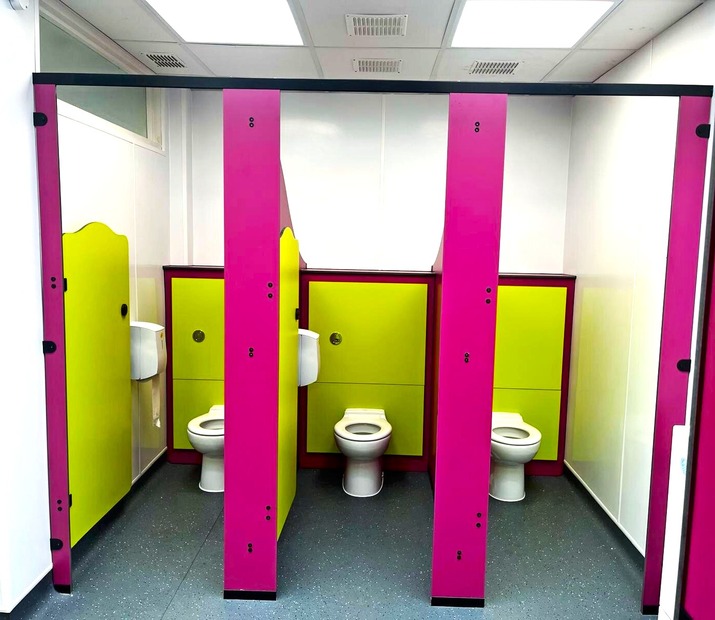 Rainbow Range children’s school toilet cubicles with bright lime and pink doors