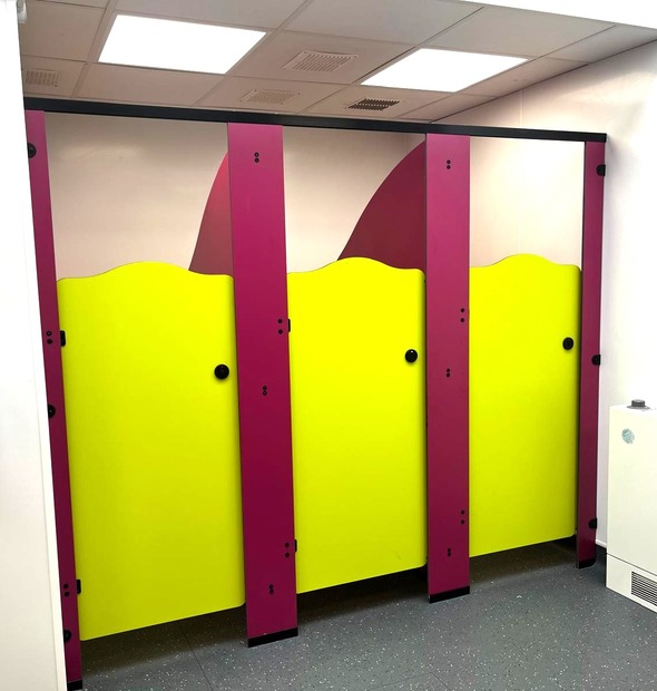 Infant Rainbow school toilet cubicles with low doors and colourful panels
