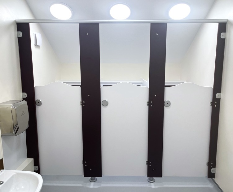 Rainbow Volante wave style school toilet cubicles with contrasting panels